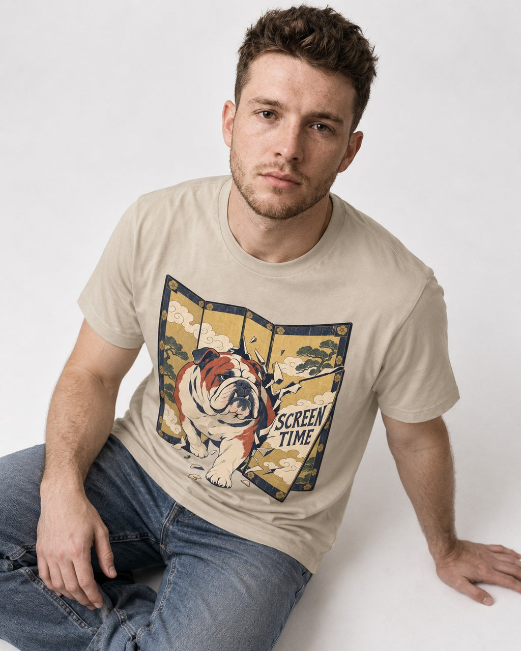 English Bulldog Screen Time T-Shirt in Sand, worn by a seated model
