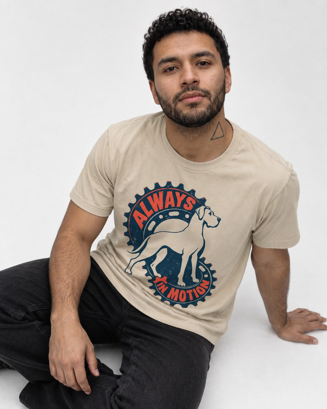 Great Dane Always in Motion T-Shirt in Sand, worn by a seated model