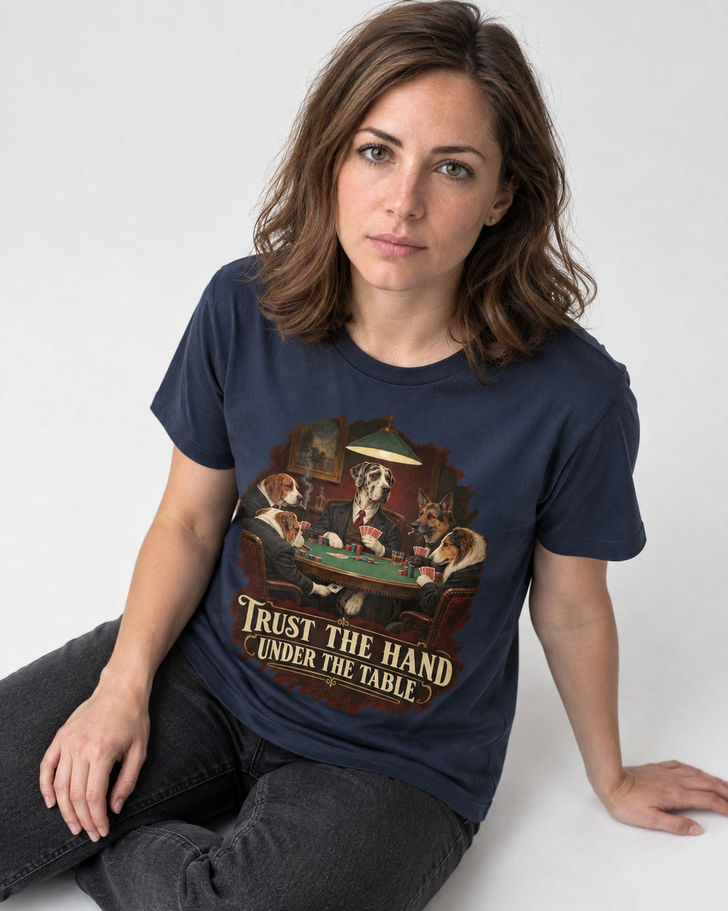Great Dane Trust the Hand Under the Table Poker Graphic T-Shirt in Navy, worn by a seated model