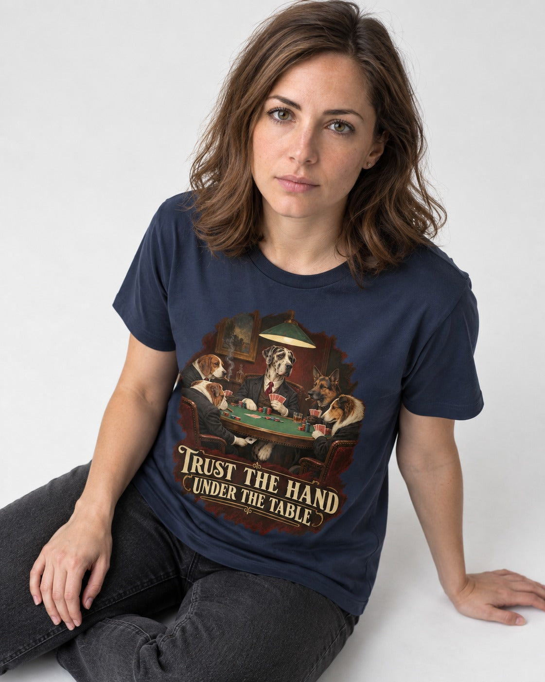 Great Dane Trust the Hand Under the Table Poker Graphic T-Shirt in Navy, worn by a seated model