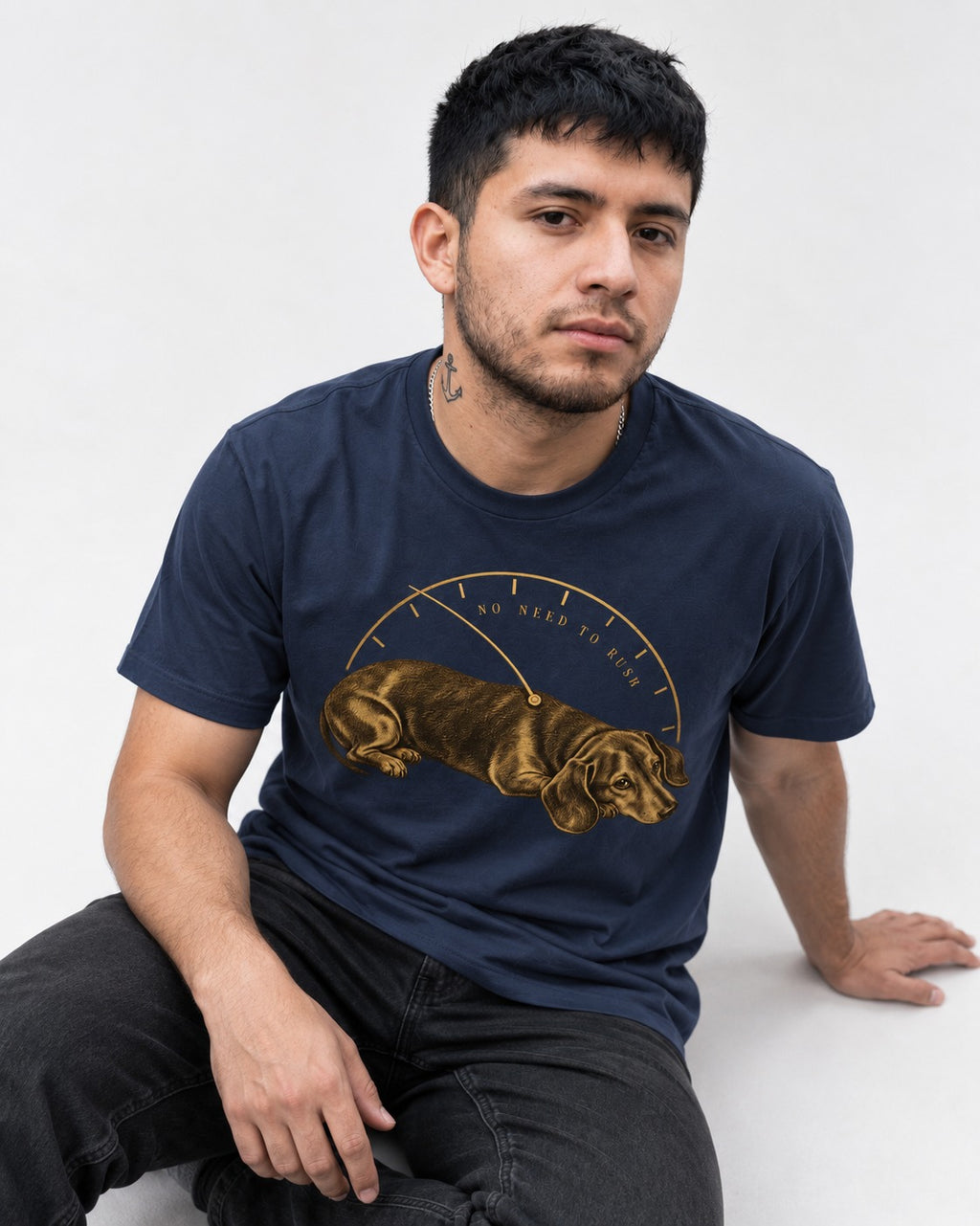 Dachshund No Need To Rush Gauge Graphic T-Shirt in Navy, worn by a seated model