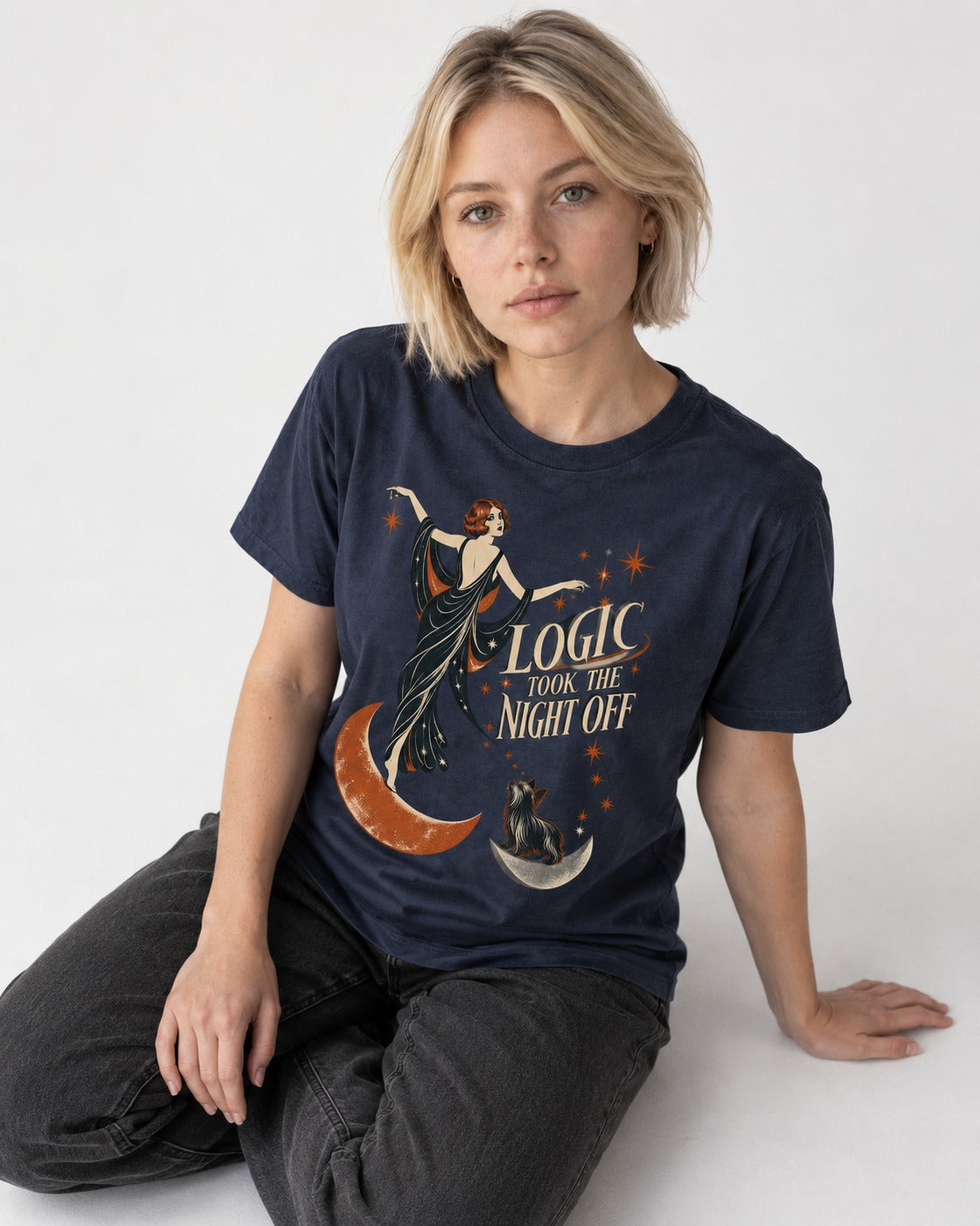Yorkshire Terrier Logic Took the Night Off Art Deco Graphic T-Shirt in Navy, worn by a seated model