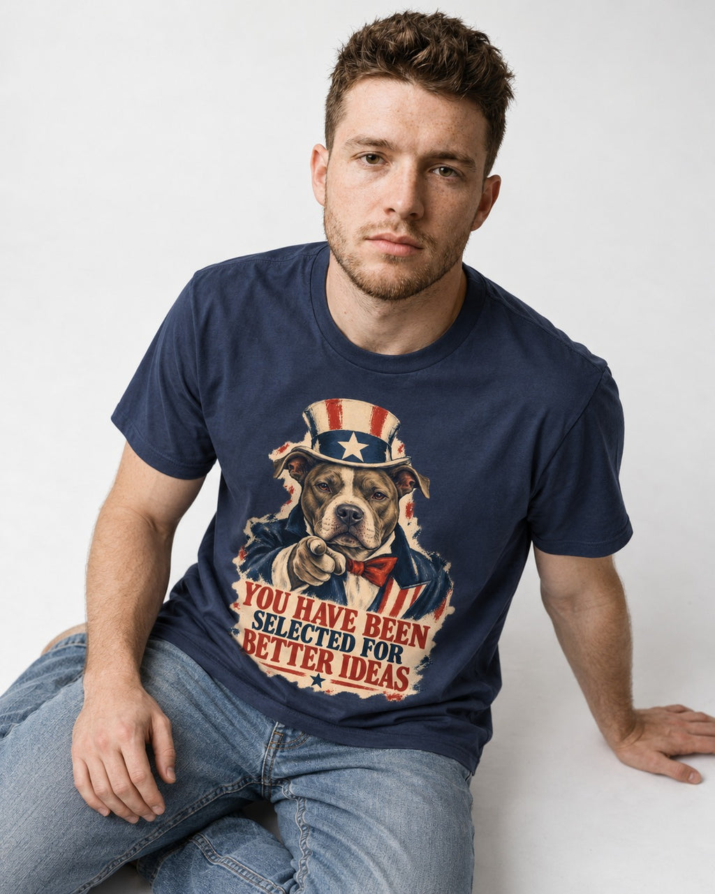 Pitbull You Have Been Selected for Better Ideas Uncle Sam Graphic T-Shirt in Navy, worn by a seated model