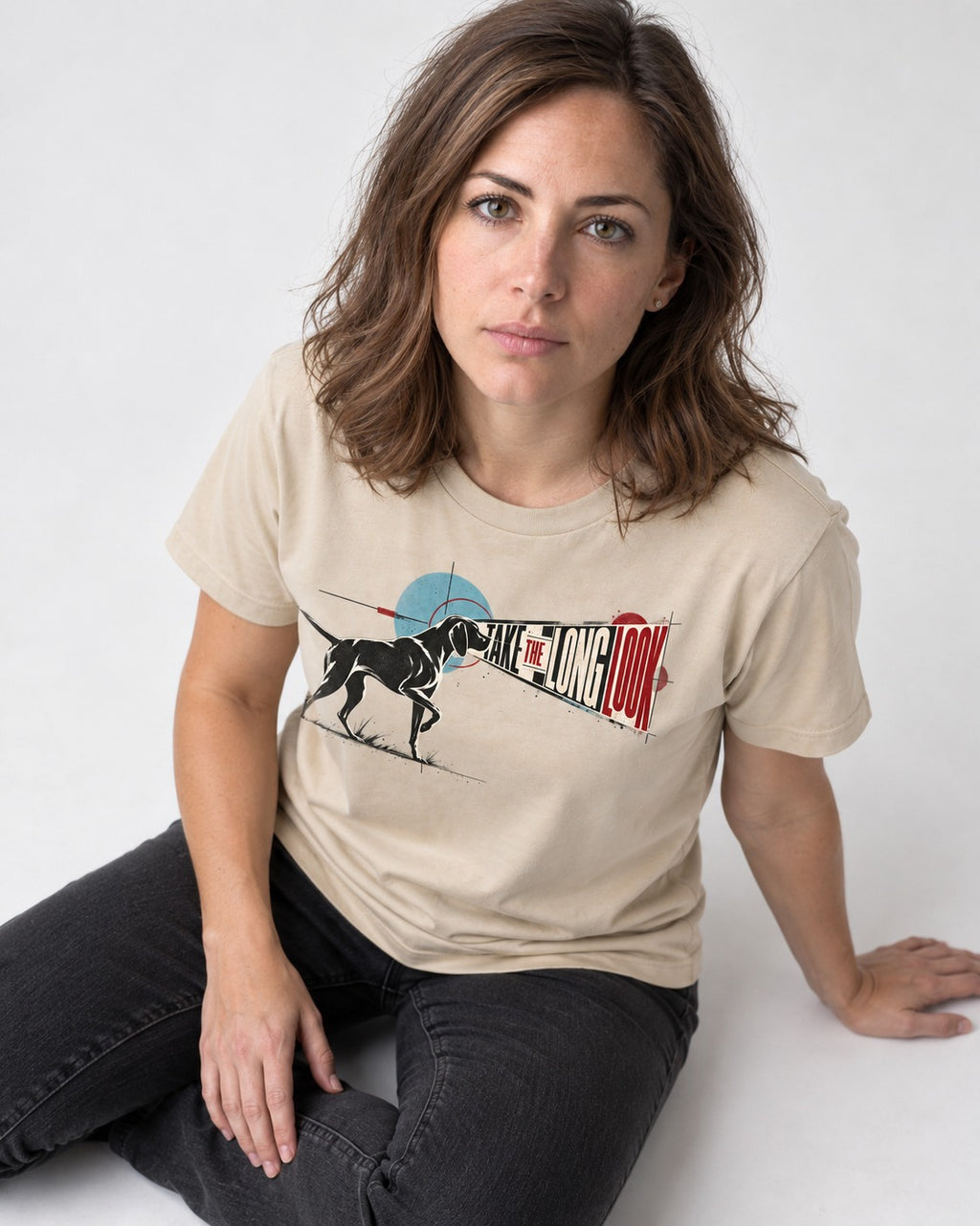 German Shorthaired Pointer Take the Long Look T-Shirt in Sand, worn by a seated model