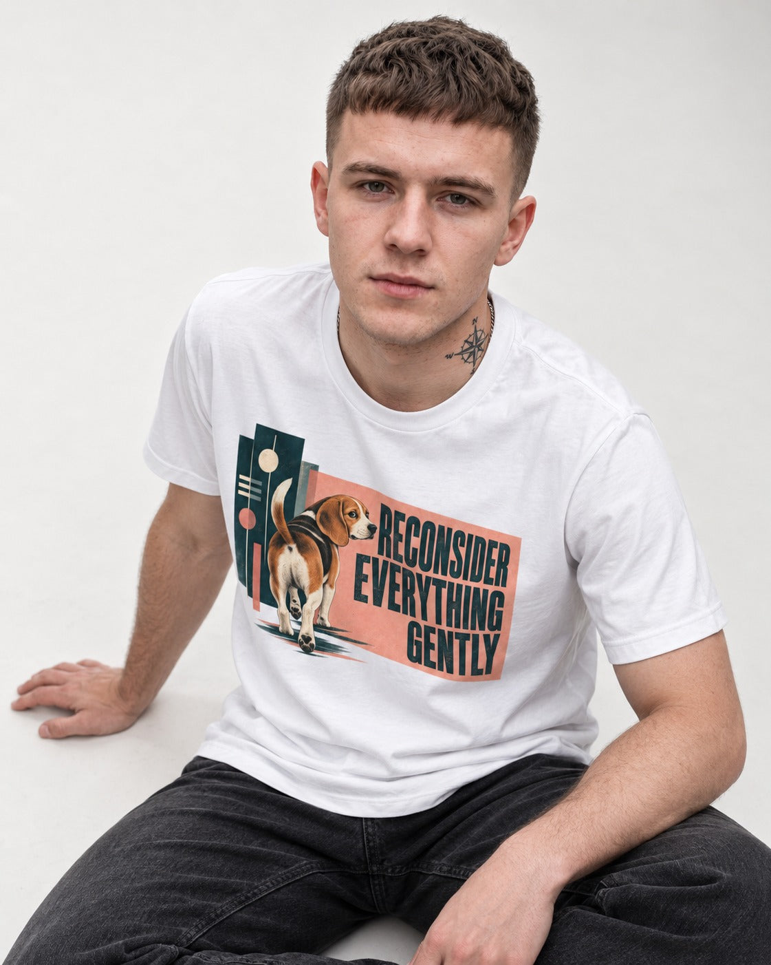Beagle Reconsider Everything Gently Retro Graphic T-Shirt in White, worn by a seated model