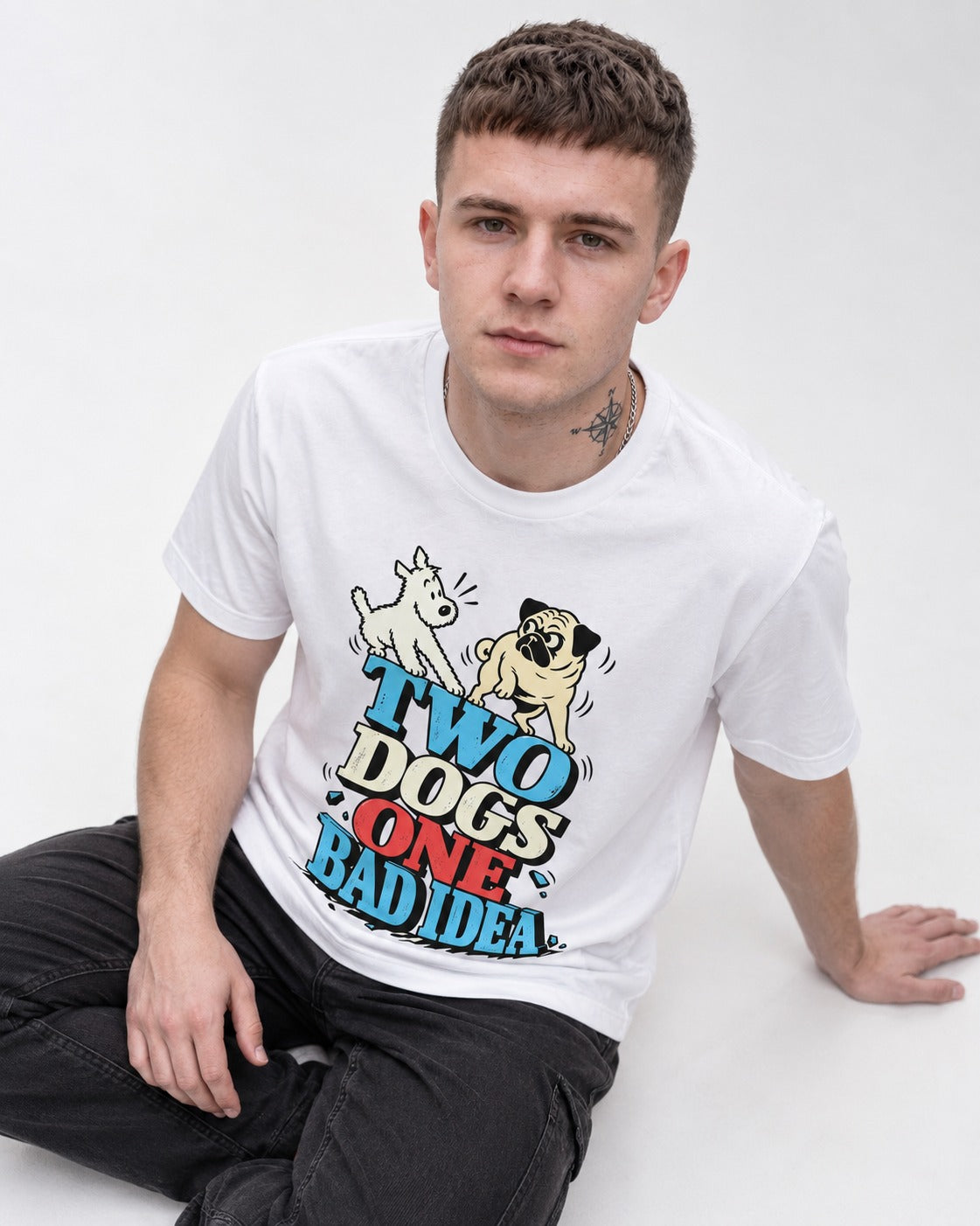 Pug Two Dogs One Bad Idea Graphic T-Shirt in White, worn by a seated model