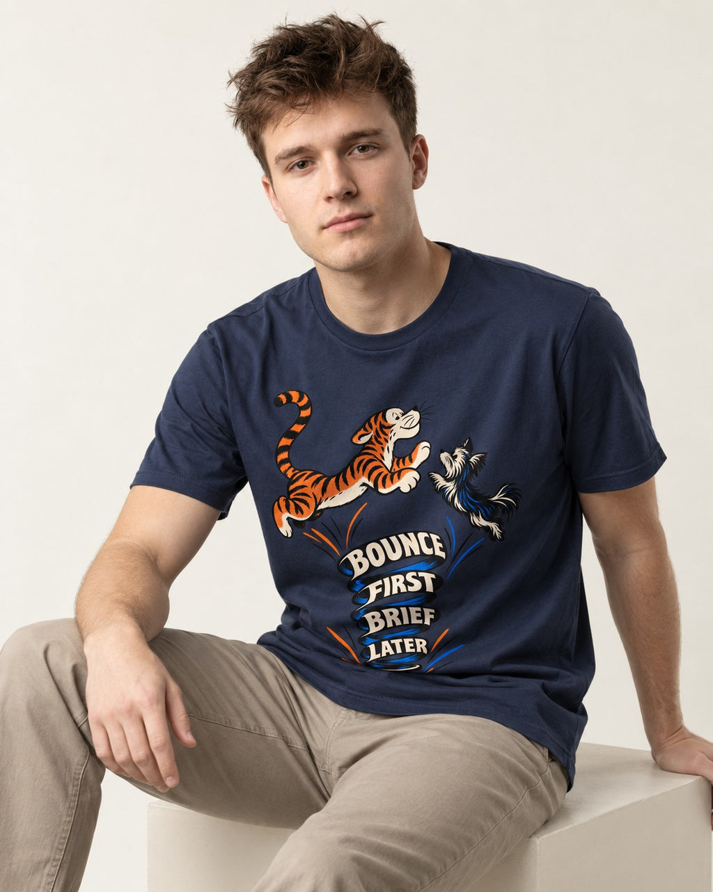Yorkshire Terrier Bounce First Brief Later Tiger Graphic T-Shirt in Navy, worn by a seated model