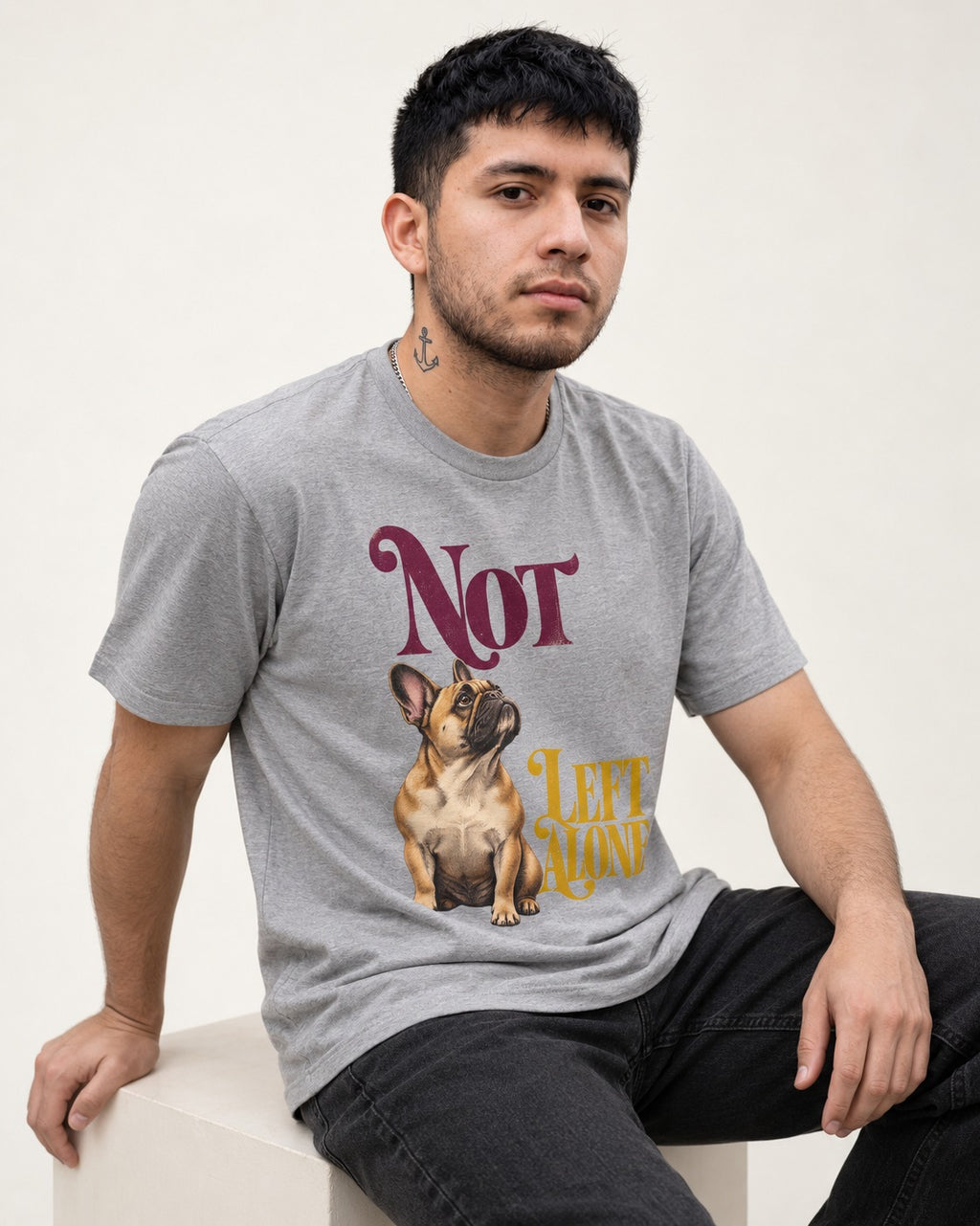 Frenchie Not Left Alone T-Shirt in Sport Grey, worn by a seated model