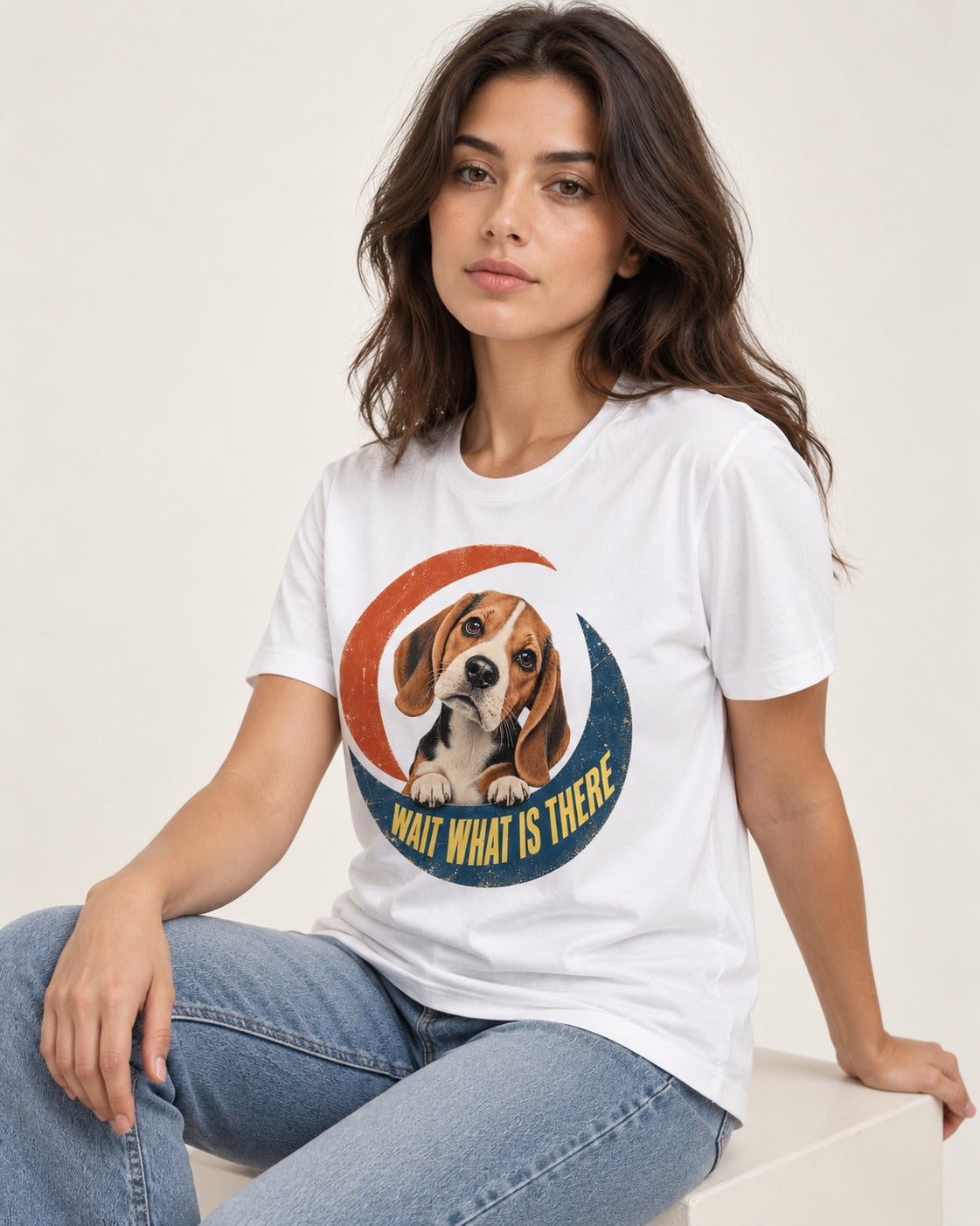 Wait What Is There Beagle Crescent T-Shirt in White, worn by a seated model