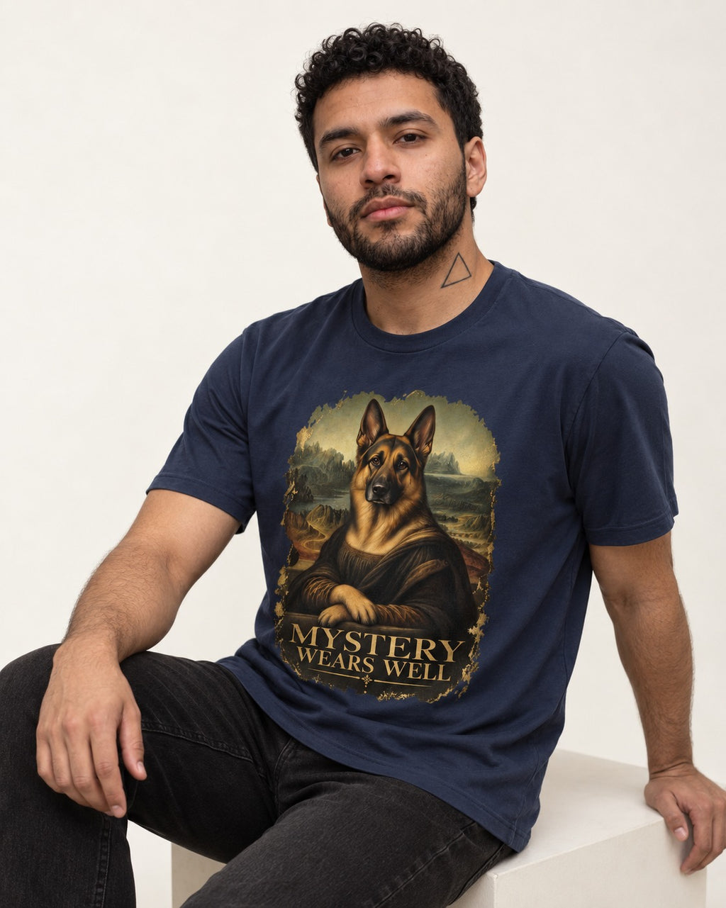 German Shepherd Dog Mystery Wears Well Renaissance Portrait T-Shirt in Navy, worn by a seated model