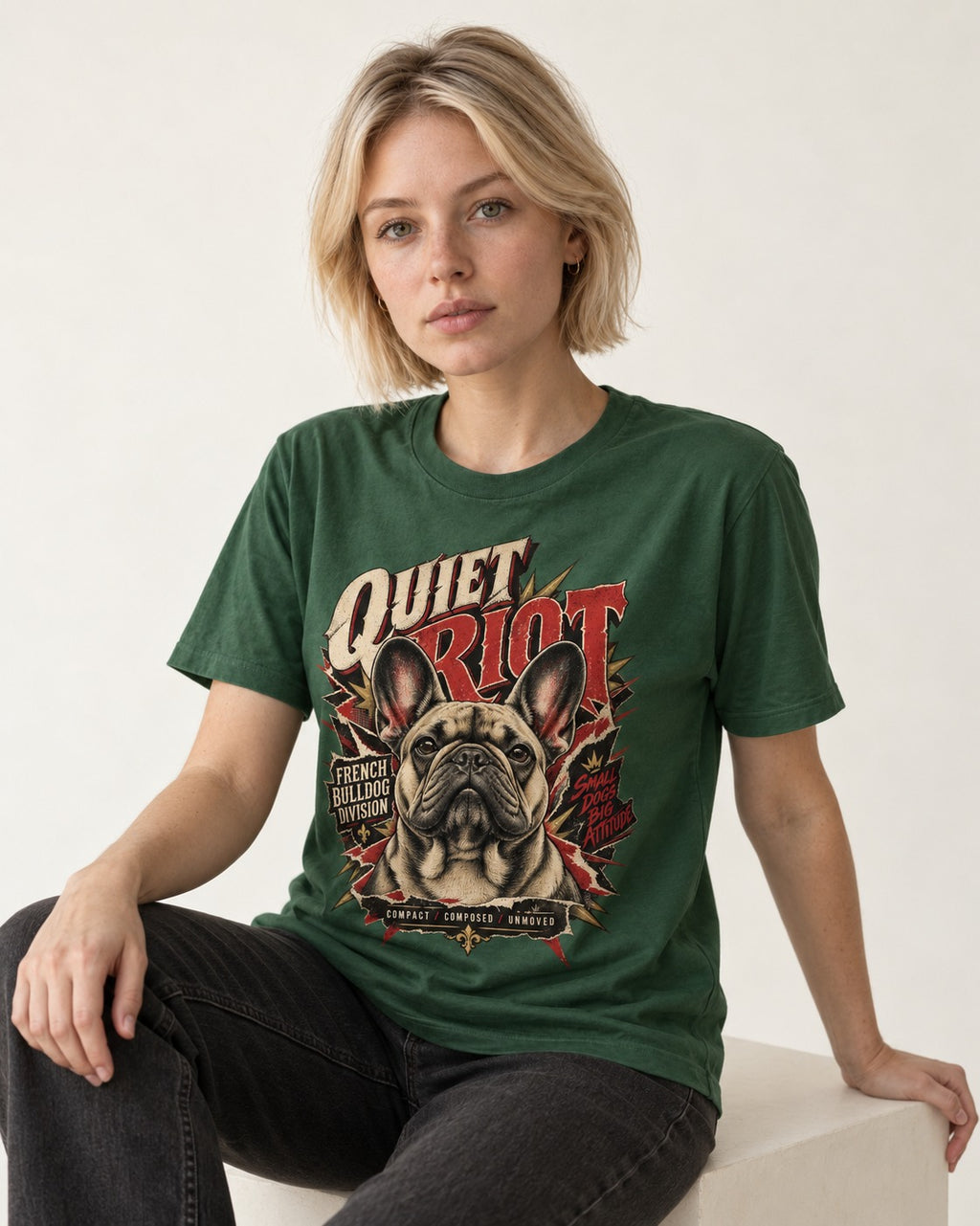 Frenchie Quiet Riot Division Emblem T-Shirt in Forest Green, worn by a seated model