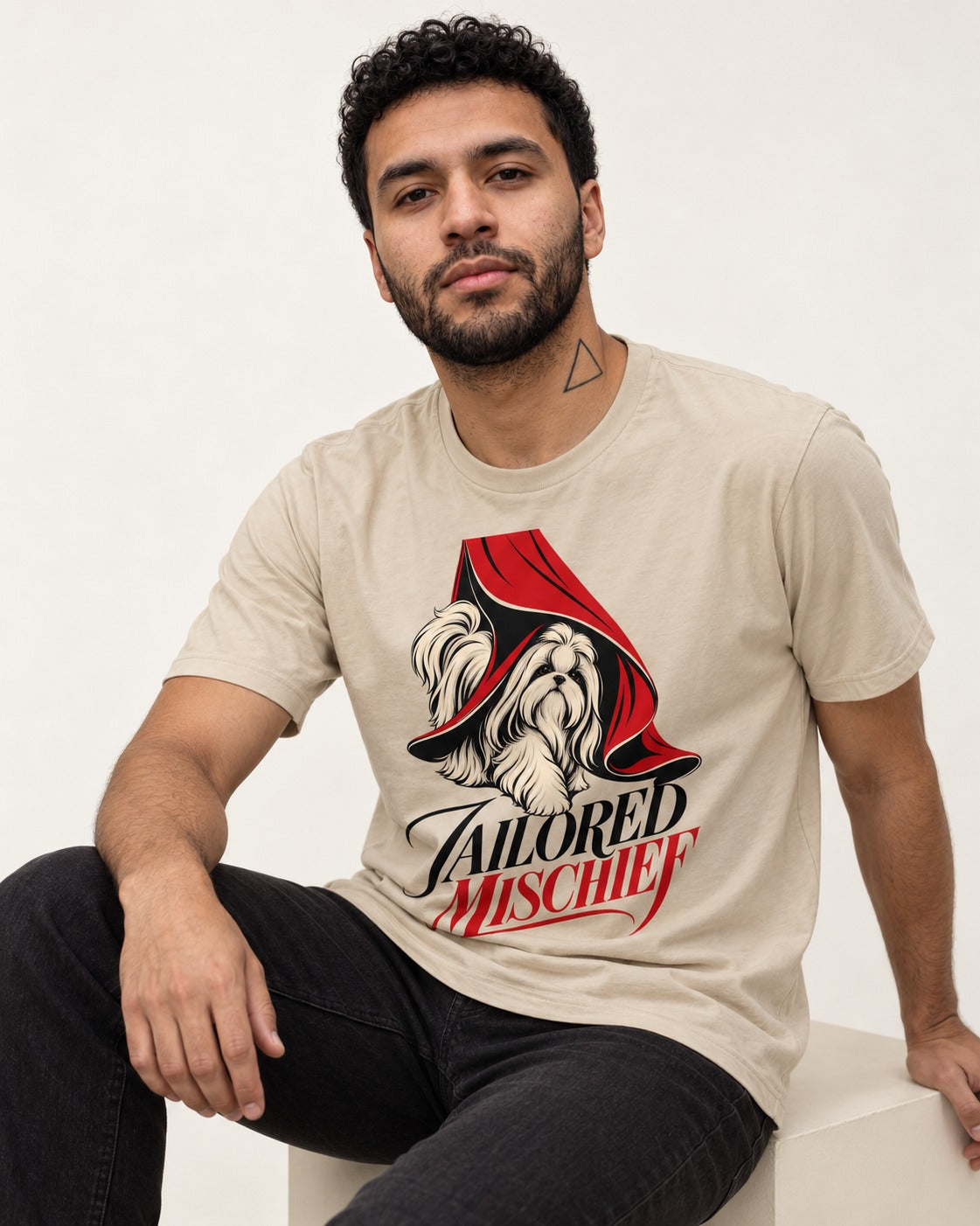 Tailored Mischief Shih Tzu T-Shirt in Sand, worn by a seated model
