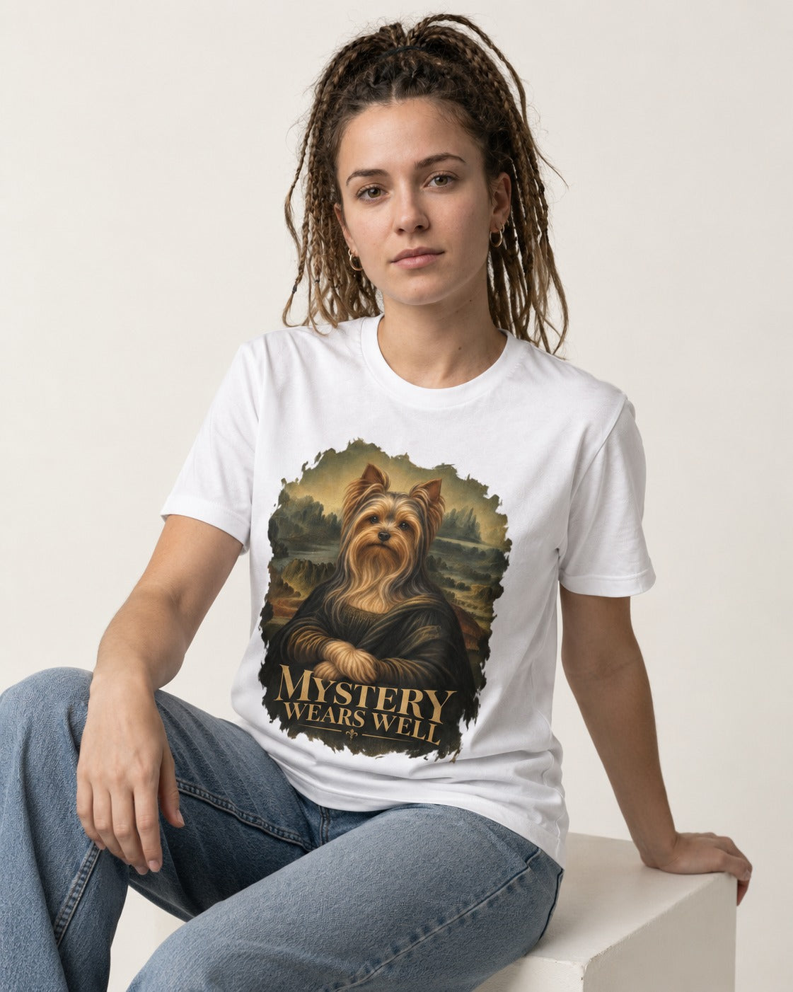 Yorkshire Terrier Mystery Wears Well Mona Lisa Portrait Graphic T-Shirt in White, worn by a seated model