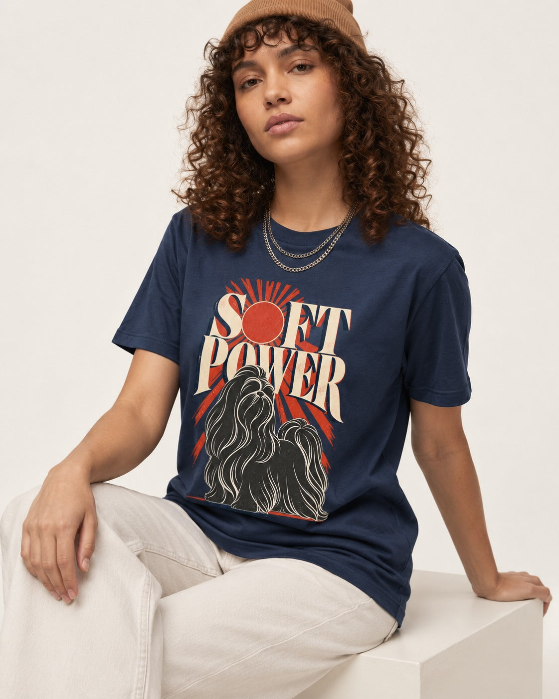 Shih Tzu Soft Power Sunburst Graphic T-Shirt in Navy, worn by a seated model