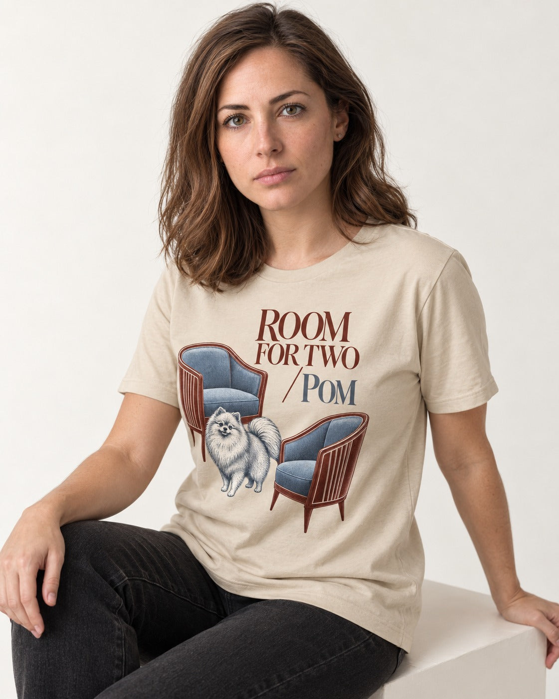 Room for Two with Pomeranian T-Shirt in Sand, worn by a seated model