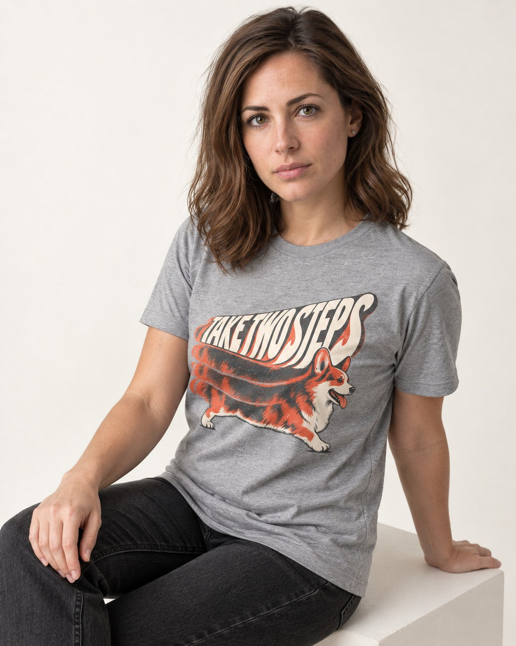 Corgi Take Two Steps Motion Trail Graphic T-Shirt in Sport Grey, worn by a seated model