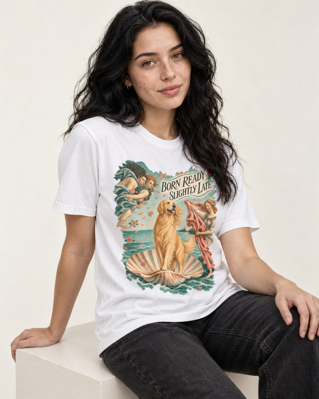 Born Ready Slightly Late Venus Golden Retriever Graphic T-Shirt in White, worn by a seated model