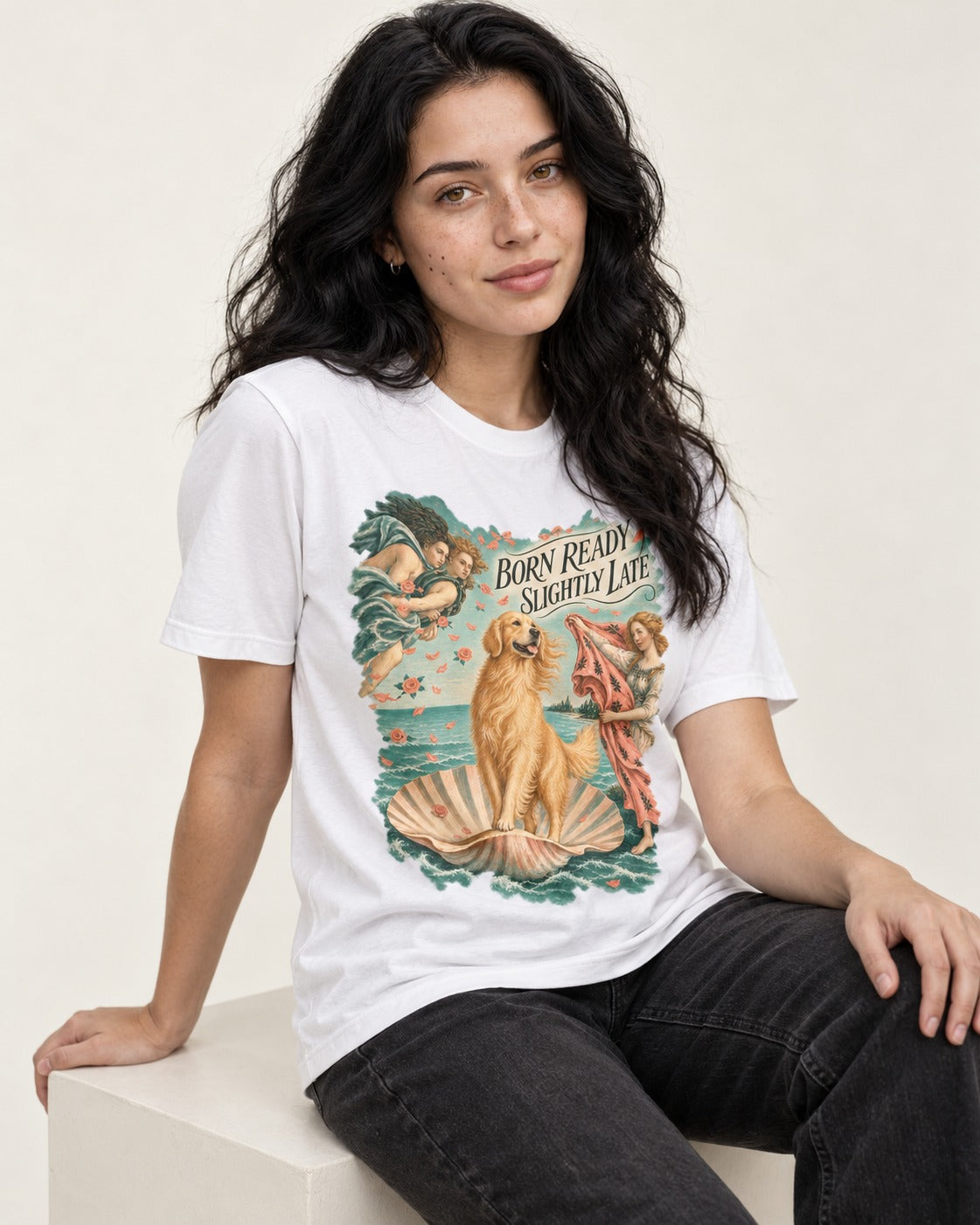 Born Ready Slightly Late Venus Golden Retriever Graphic T-Shirt in White, worn by a seated model