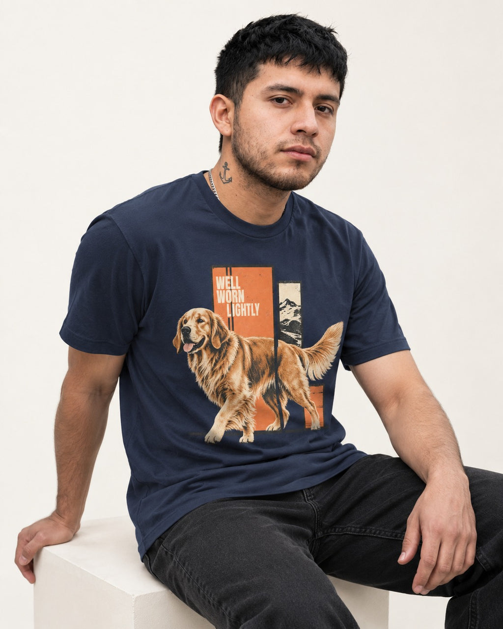 Golden Retriever Well Worn Lightly Mountain Graphic T-Shirt in Navy, worn by a seated model