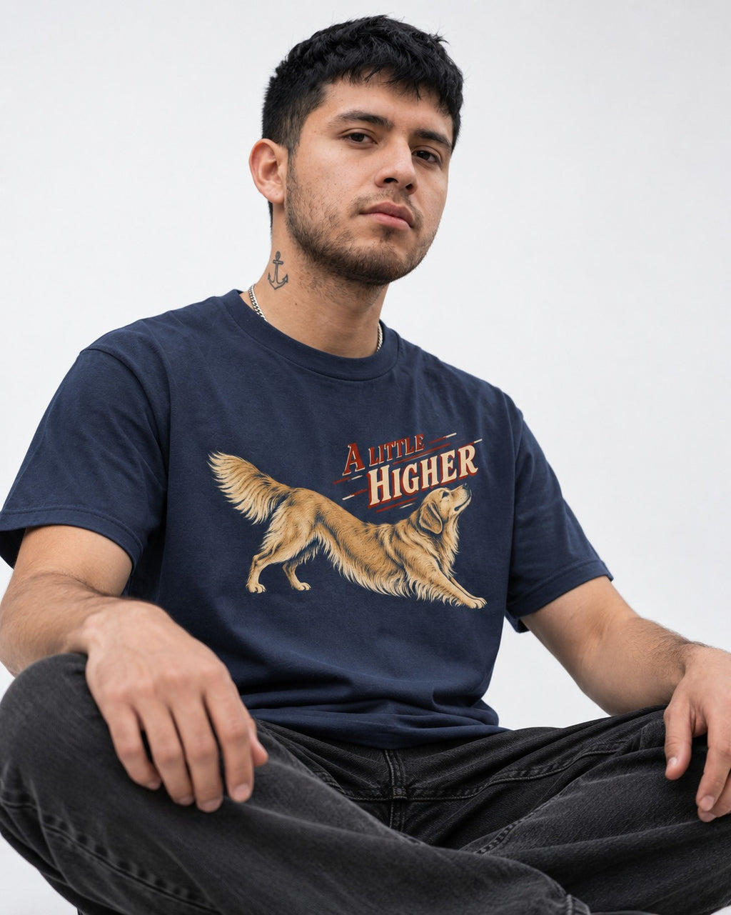 Golden Retriever A Little Higher Play Bow Graphic T-Shirt in Navy, worn by a seated model