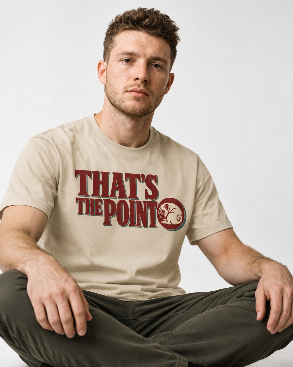 Pug's the Point T-Shirt in Sand, worn by a seated model