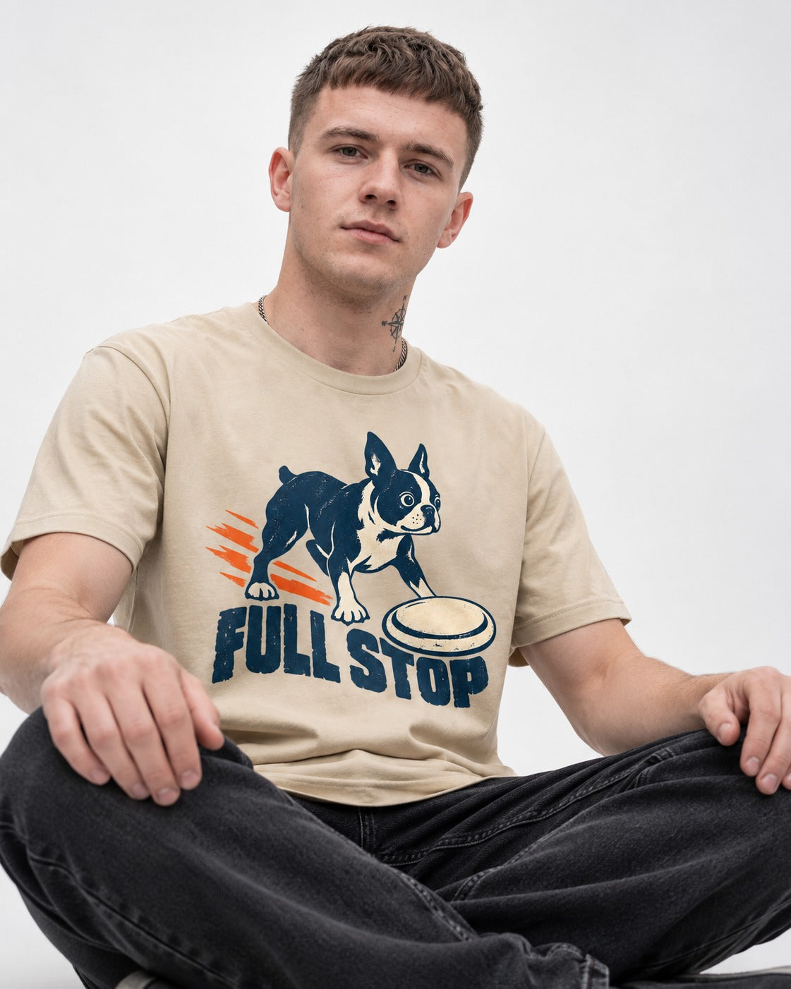 Boston Terrier Full Stop T-Shirt in Sand, worn by a seated model