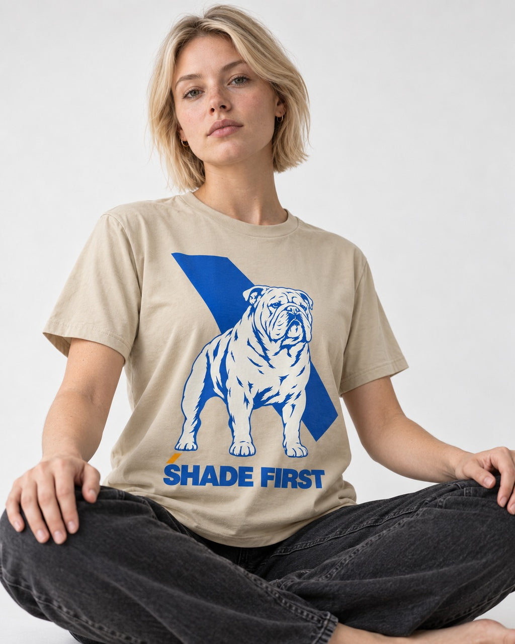 Shade First English Bulldog T-Shirt in Sand, worn by a seated model