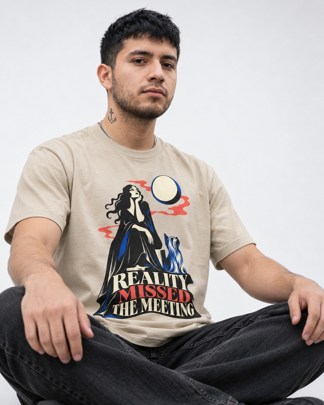 Yorkshire Terrier Reality Missed the Meeting T-Shirt in Sand, worn by a seated model