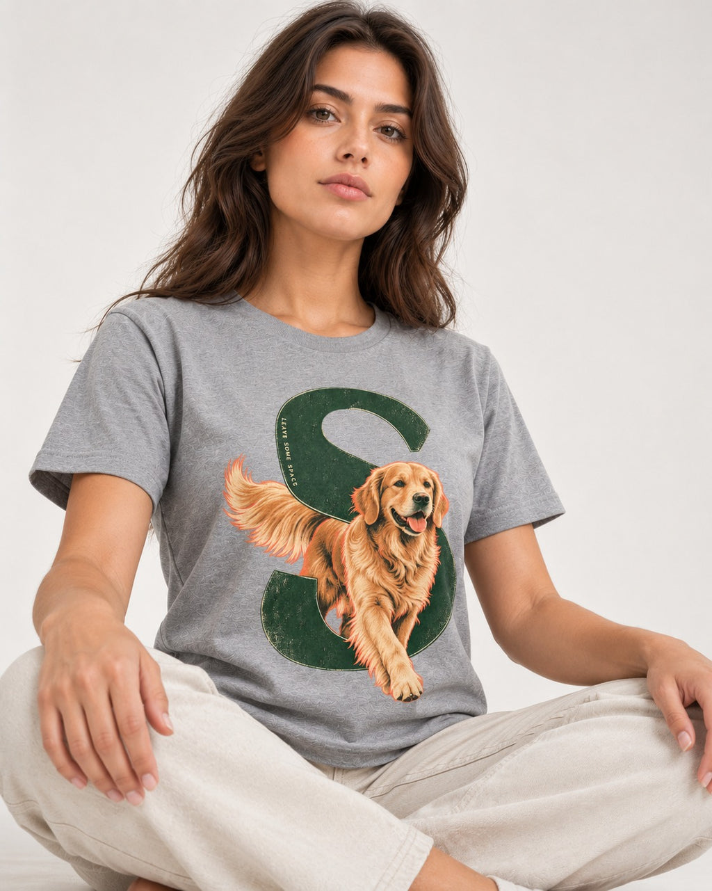 Golden Retriever Leave Some Space Monogram Graphic T-Shirt in Sport Grey, worn by a seated model
