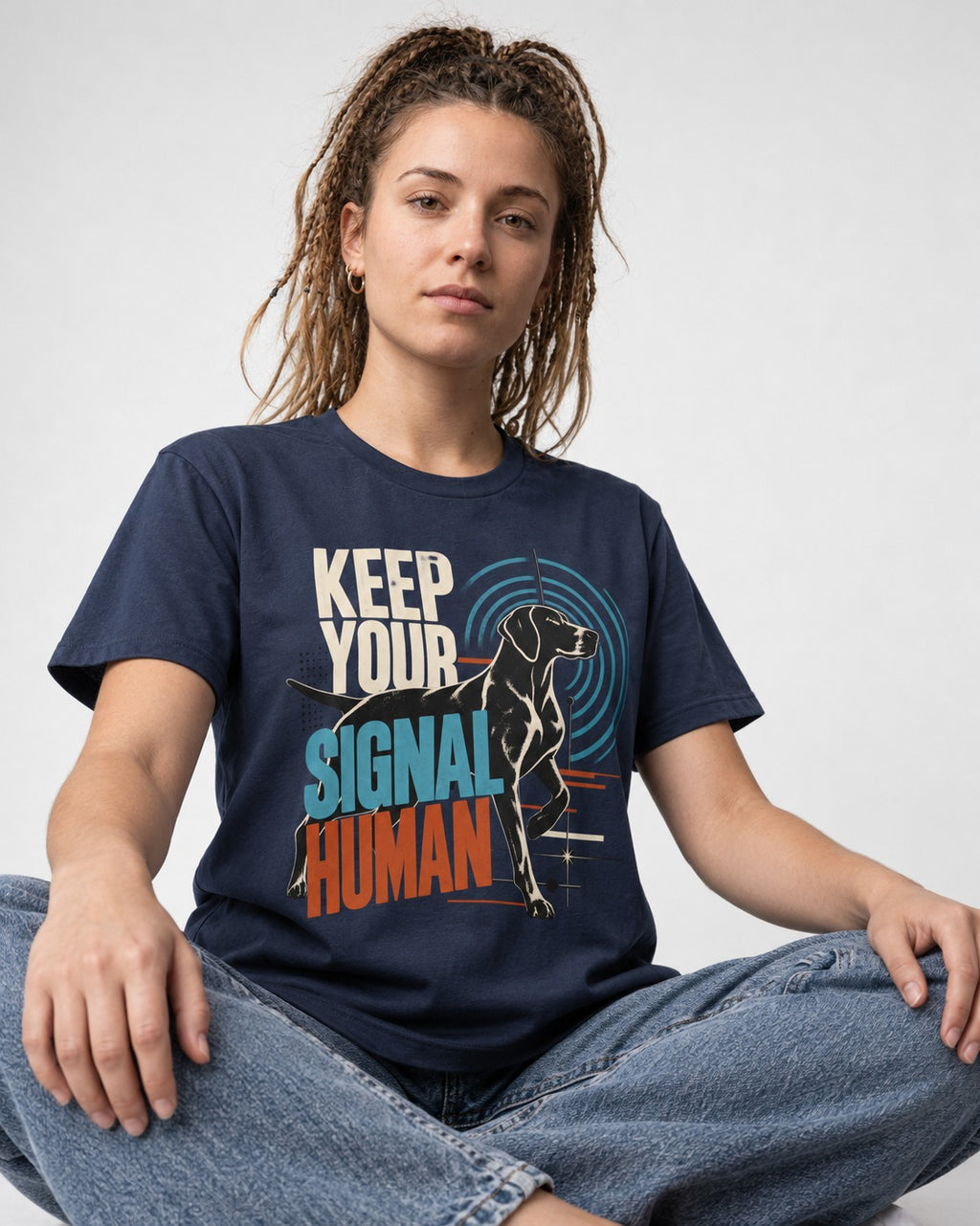 German Shorthaired Pointer Keep Your Signal Human Broadcast Graphic T-Shirt in Navy, worn by a seated model