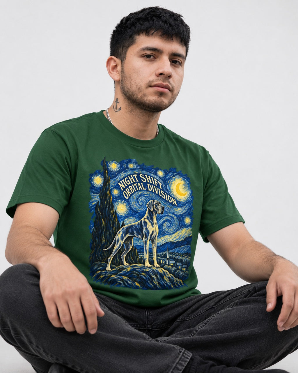 Great Dane Night Shift Orbital Division Starry Sky Graphic T-Shirt in Forest Green, worn by a seated model