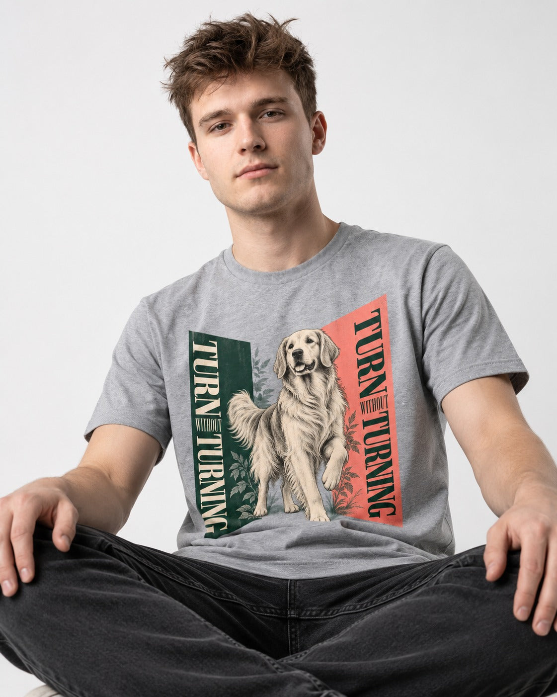 Golden Retriever Turn Without Turning Gateway Graphic T-Shirt in Sport Grey, worn by a seated model