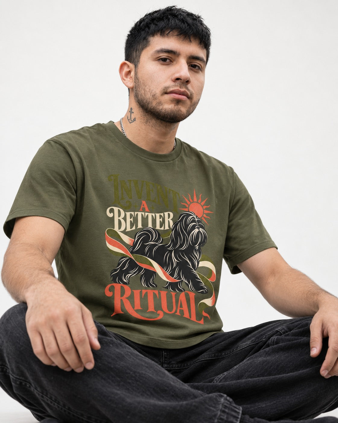 Shih Tzu Invent A Better Ritual Sunrise Ribbon Graphic T-Shirt in Heather Military Green, worn by a seated model