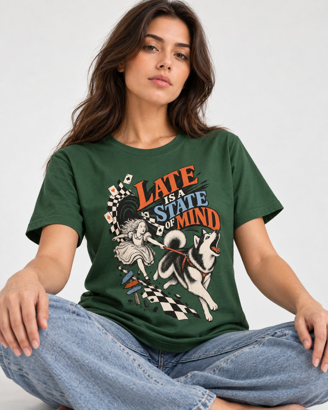 Husky Late Is a State of Mind Wonderland Chase Graphic T-Shirt in Forest Green, worn by a seated model