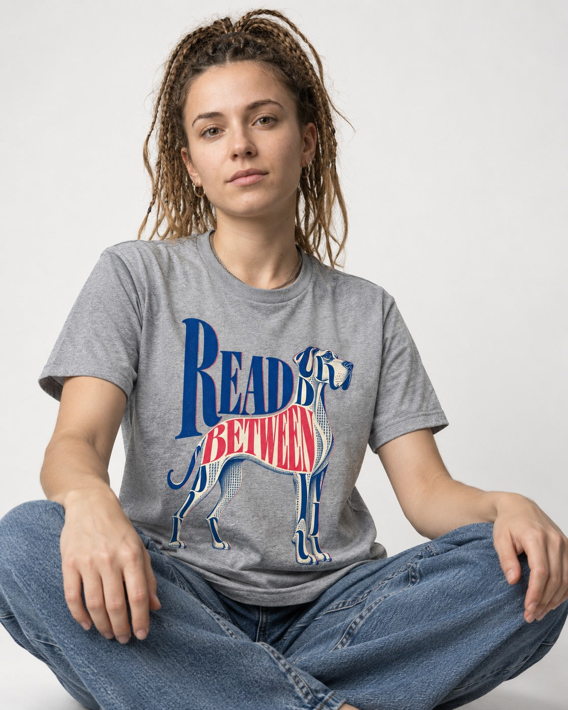 Read Between the Lines Great Dane T-Shirt in Sport Grey, worn by a seated model