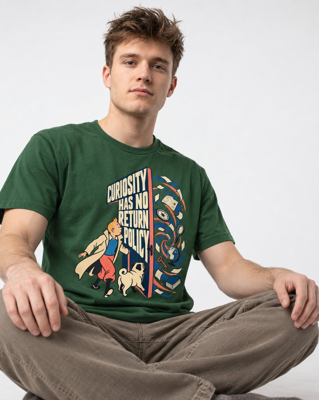 Pug Curiosity Has No Return Policy Portal Graphic T-Shirt in Forest Green, worn by a seated model