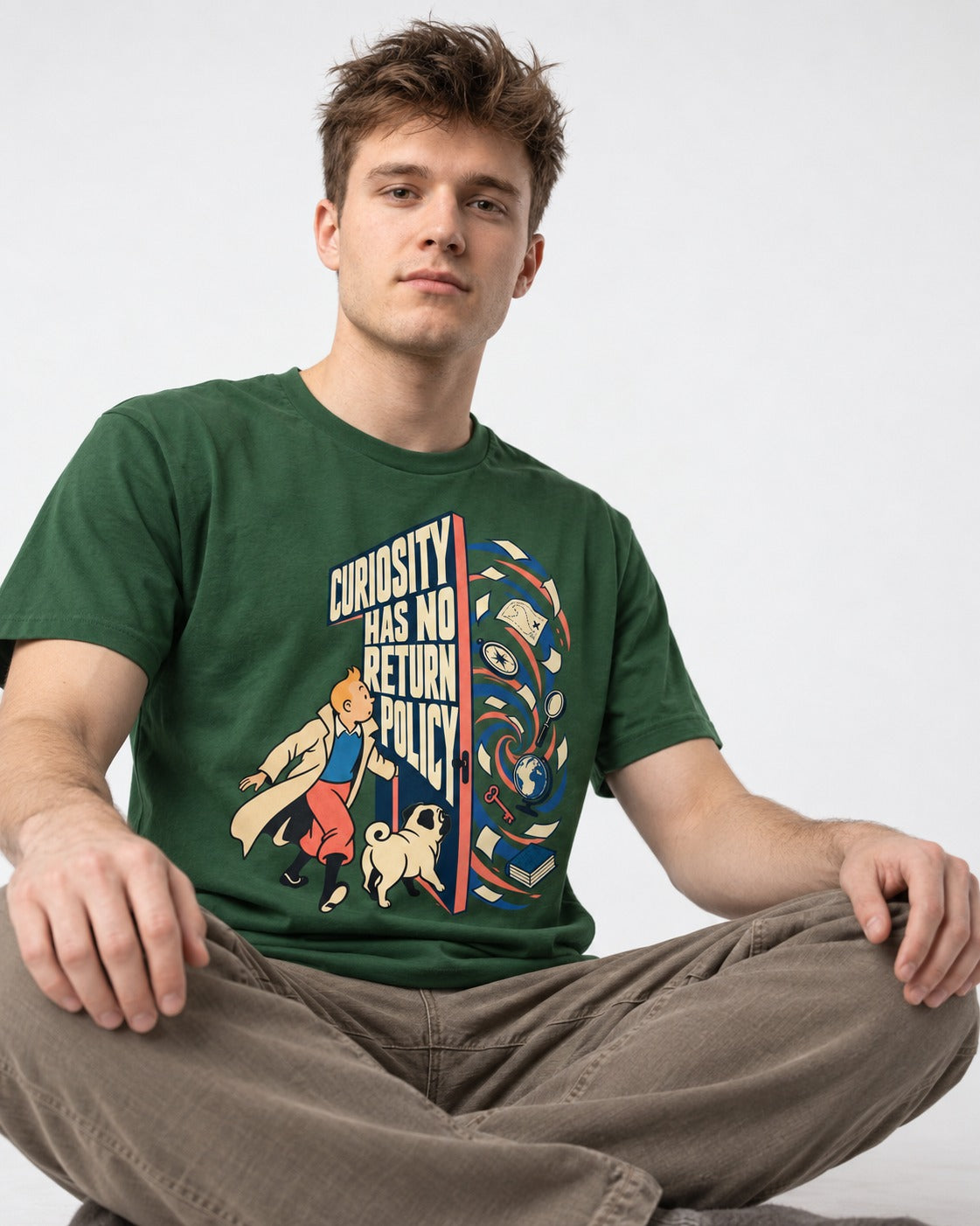 Pug Curiosity Has No Return Policy Portal Graphic T-Shirt in Forest Green, worn by a seated model