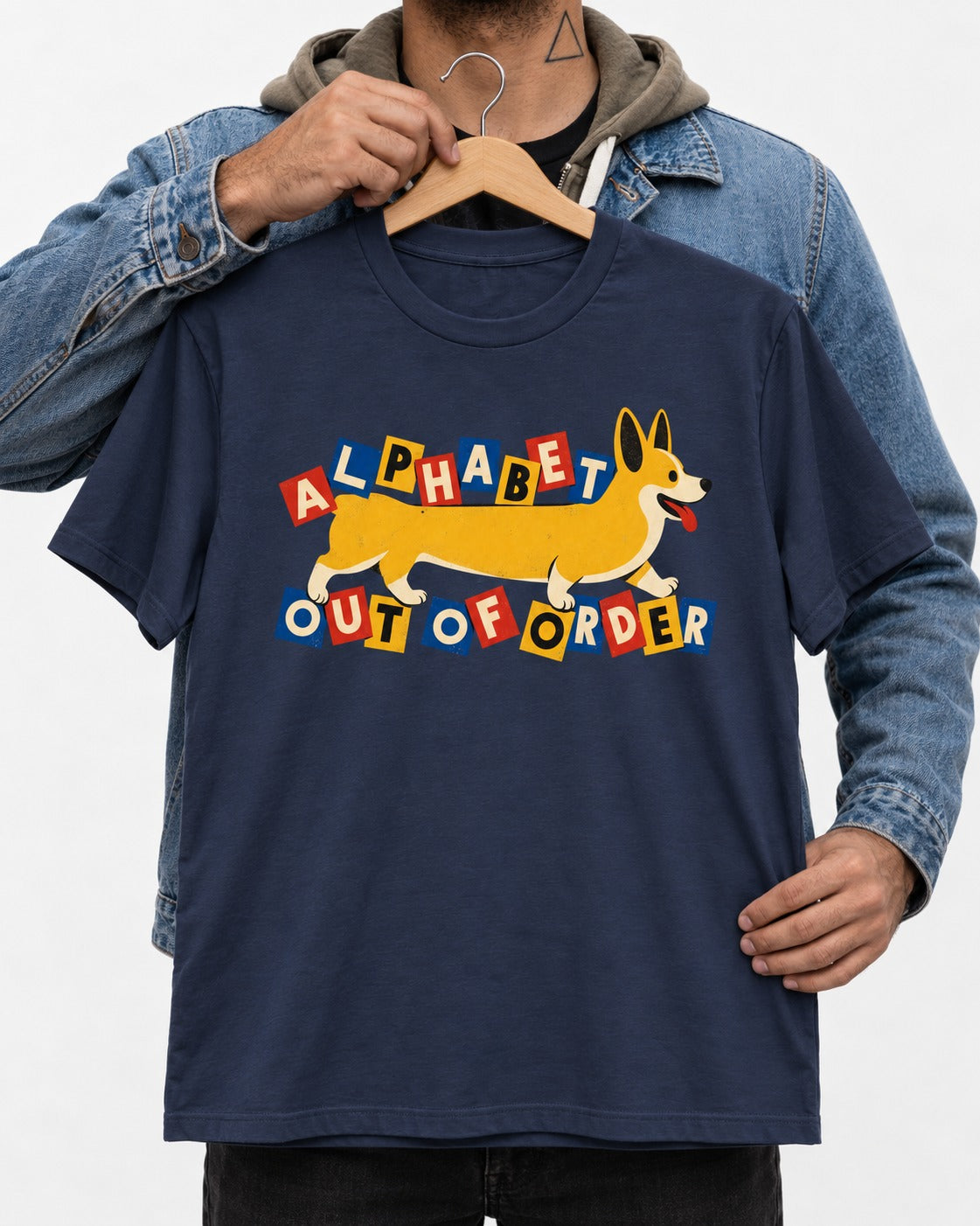 Corgi Alphabet Out of Order Graphic T-Shirt in Navy, held up on a hanger