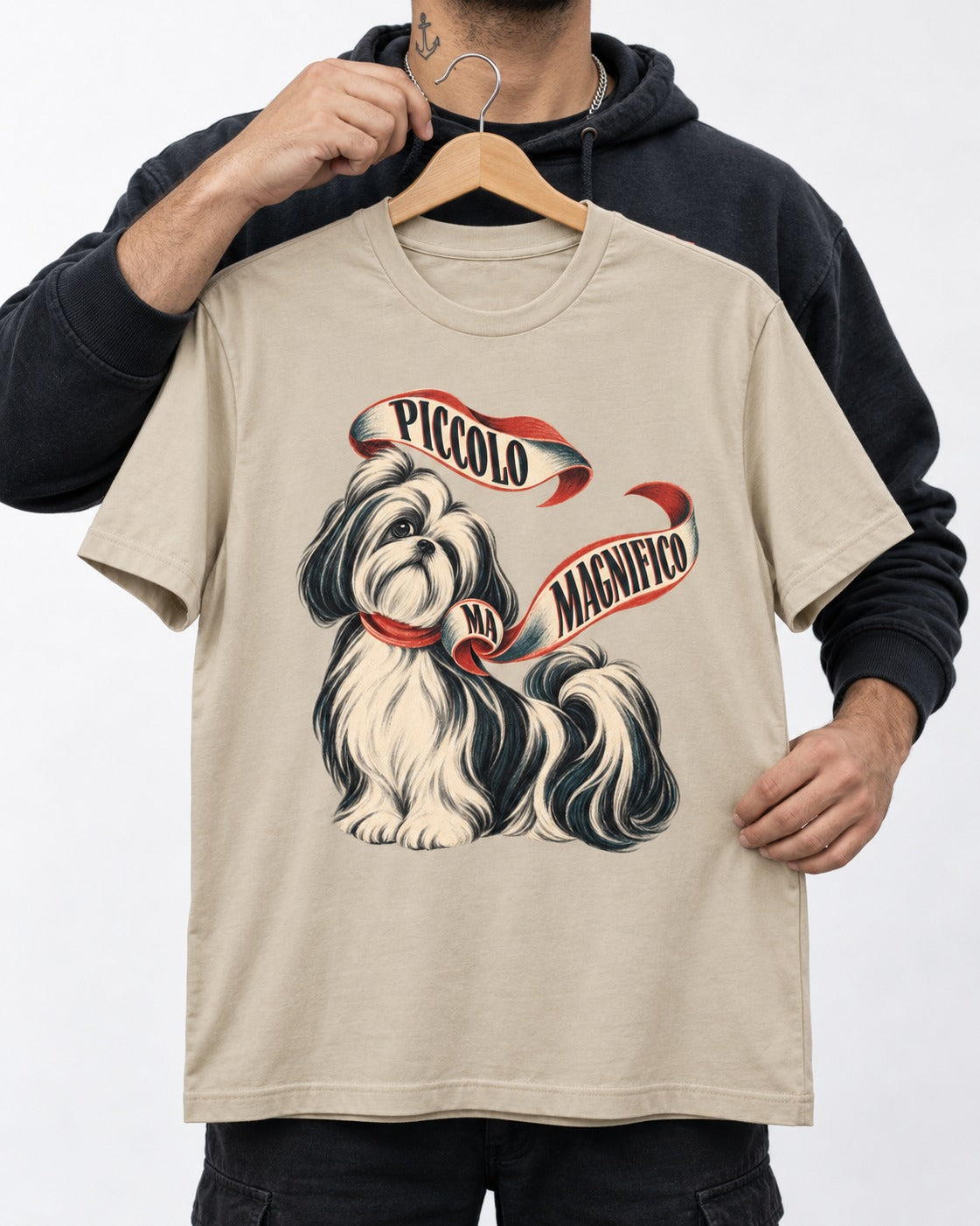 Piccolo Ma Magnifico Shih Tzu T-Shirt in Sand, held up on a hanger