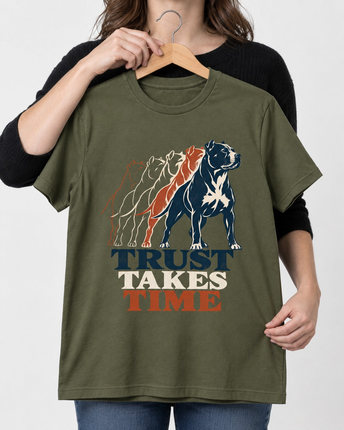 Pitbull Trust Takes Time Progression Graphic T-Shirt in Heather Military Green, held up on a hanger