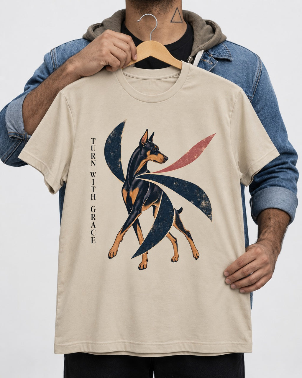 Turn with Doberman Grace T-Shirt in Sand, held up on a hanger