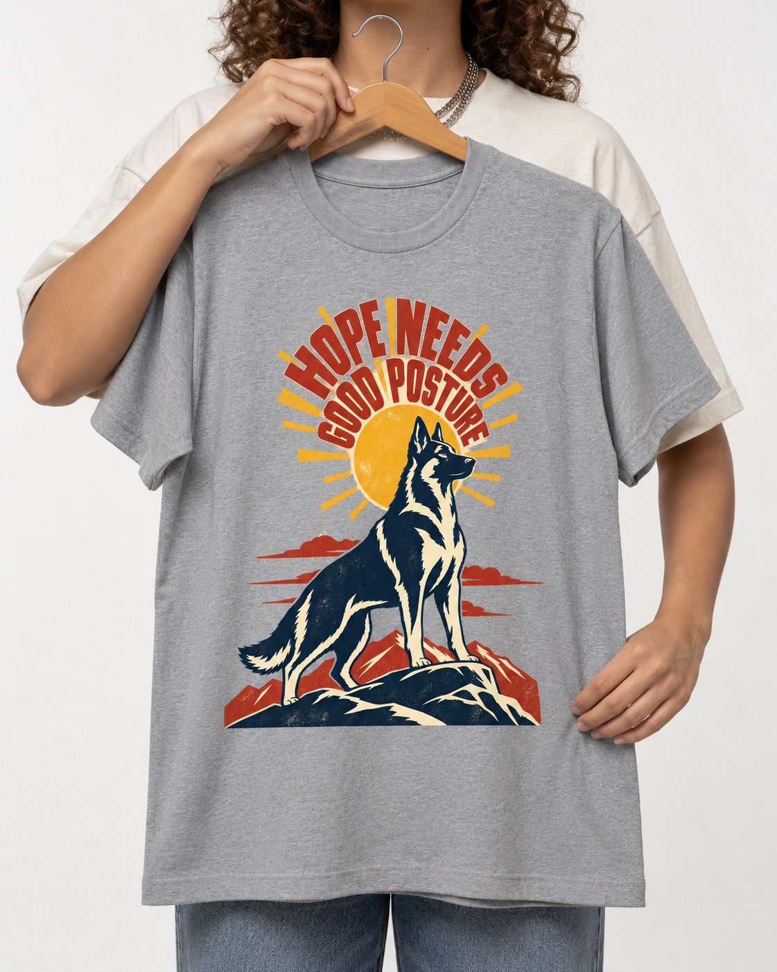 Hope Needs Good Posture German Shepherd Dog T-Shirt in Sport Grey, held up on a hanger