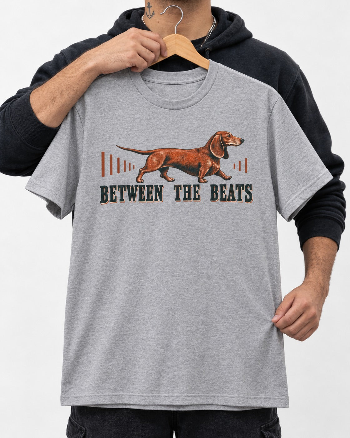 Dachshund Between the Beats T-Shirt in Sport Grey, held up on a hanger