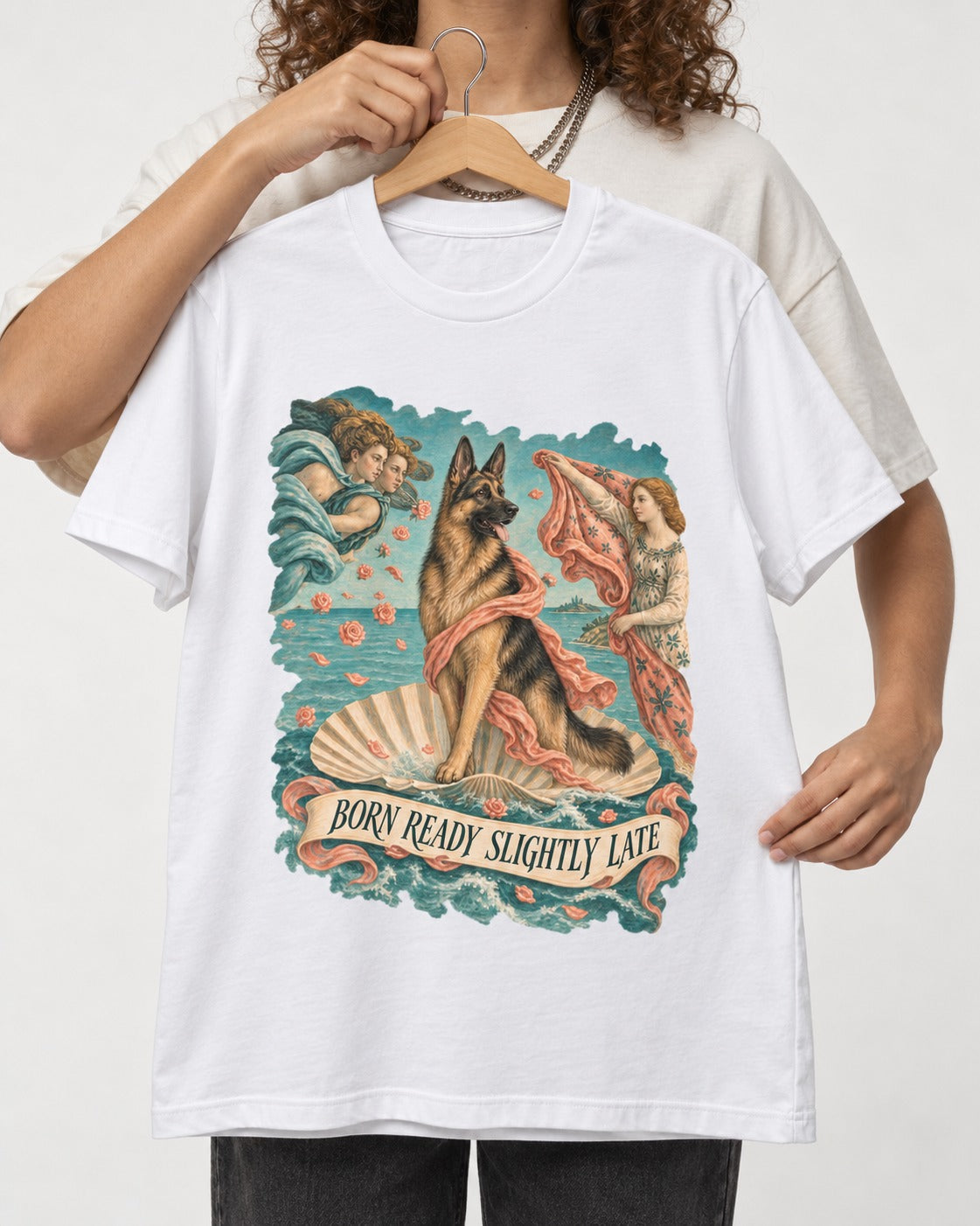 German Shepherd Dog Born Ready Slightly Late Venus Graphic T-Shirt in White, held up on a hanger