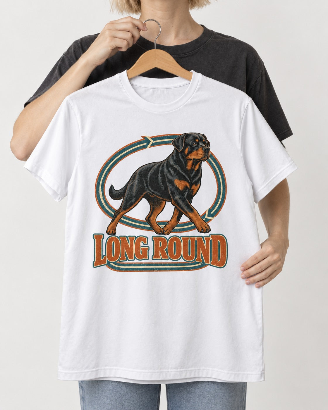 Rottweiler Long Round Circular Track Graphic T-Shirt in White, held up on a hanger