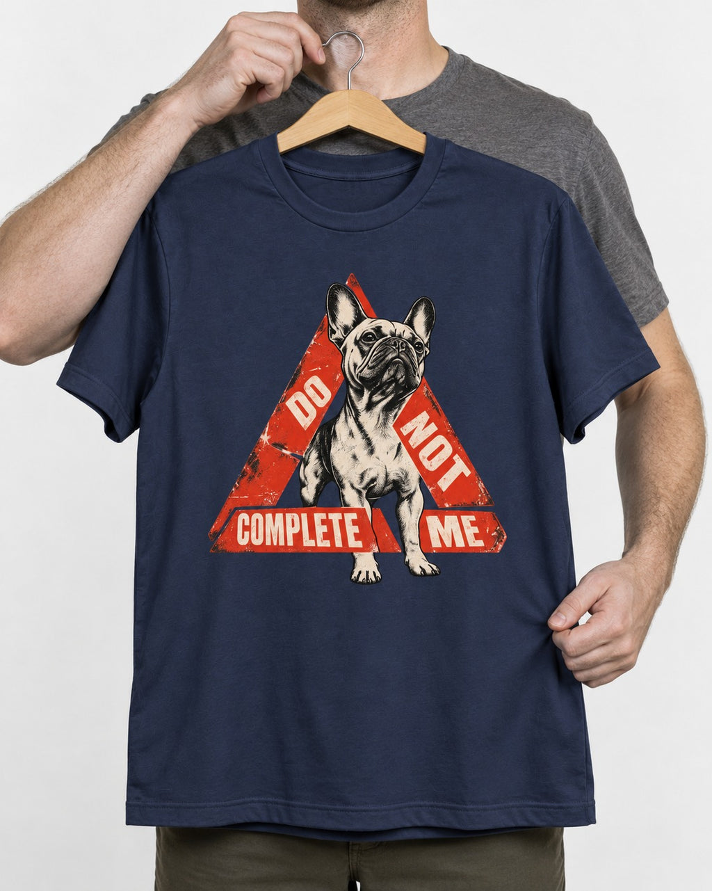 Frenchie Do Not Complete Me Warning Triangle Graphic T-Shirt in Navy, held up on a hanger