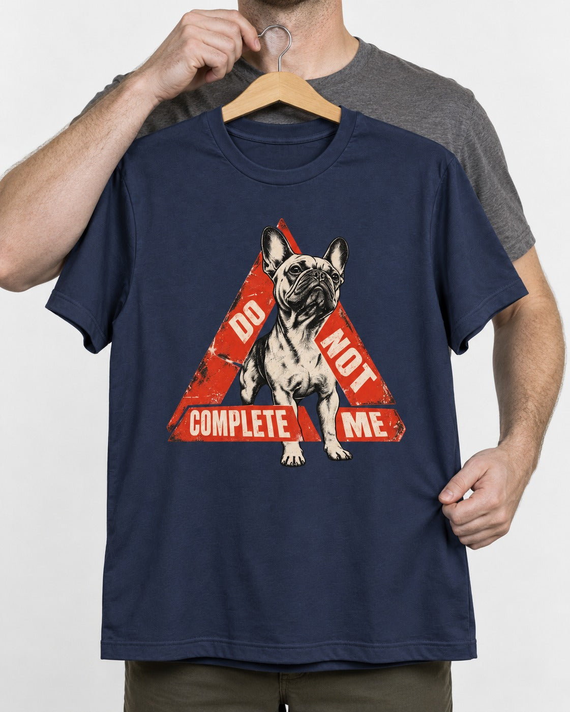 Frenchie Do Not Complete Me Warning Triangle Graphic T-Shirt in Navy, held up on a hanger