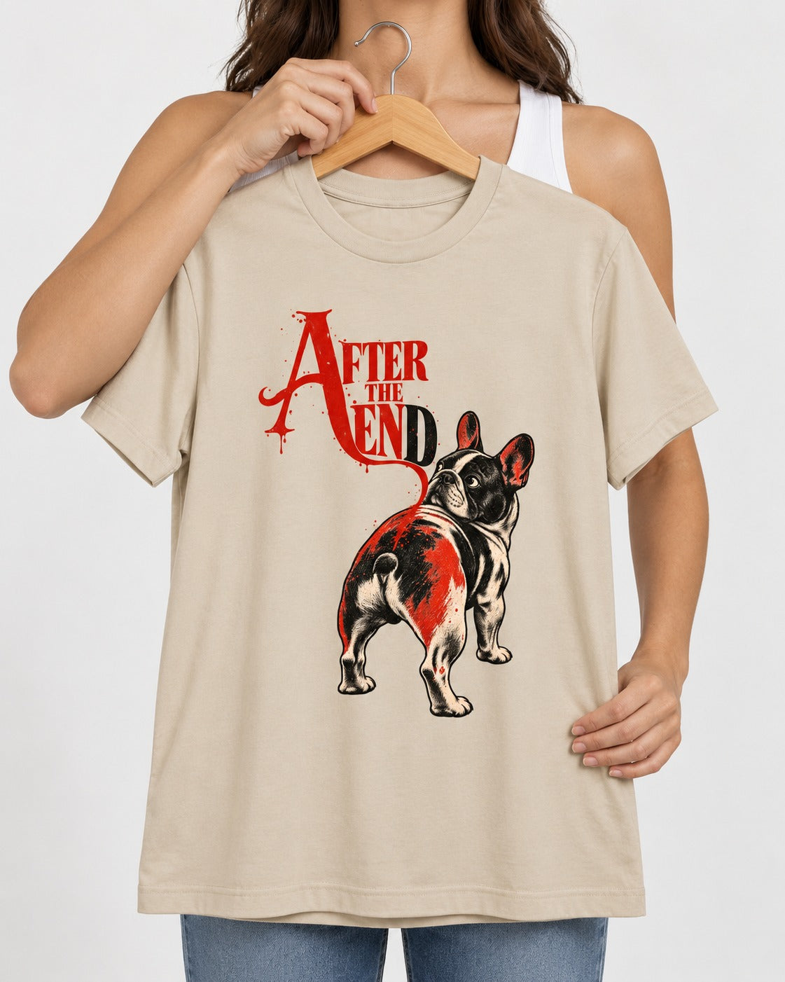 Frenchie After the End T-Shirt in Sand, held up on a hanger