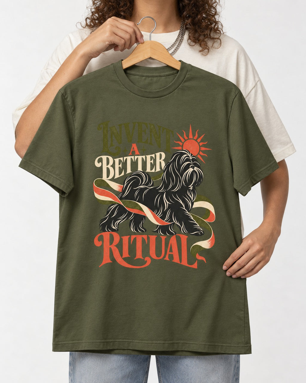 Shih Tzu Invent A Better Ritual Sunrise Ribbon Graphic T-Shirt in Heather Military Green, held up on a hanger