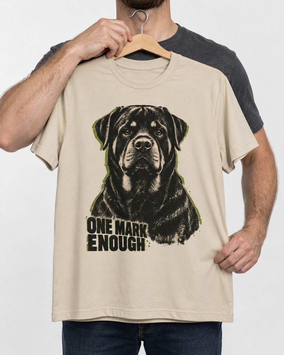 Rottweiler One Mark Enough T-Shirt in Sand, held up on a hanger